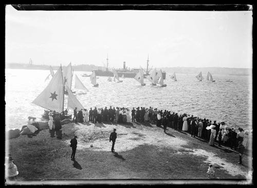 Spectators on Clark Island watching the beginning of an 18-footer race