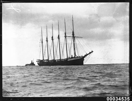 The six-masted schooner HELEN B STERLING under tow