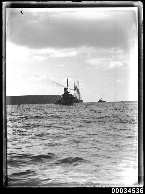 The six-masted schooner HELEN B STERLING under tow