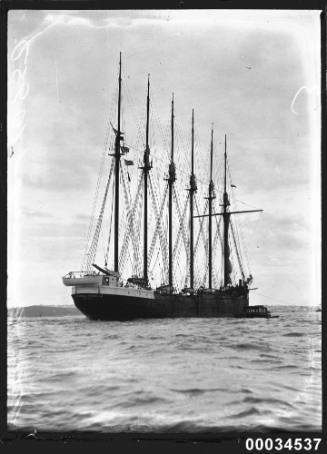 The six-masted schooner HELEN B STERLING under tow