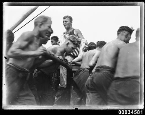 Sailors and an accordion player on board MAGDALENE VINNEN