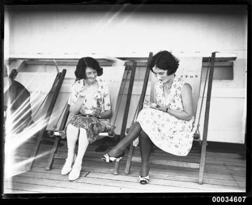 Two women seated on deck chairs on board SS ORMISTON