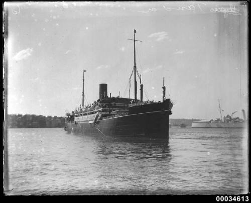 TANDA in harbour with ferry and warship