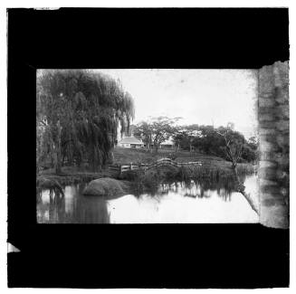 Waterfront view with house at an unknown site