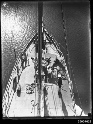 Men on the deck of sailing vessel