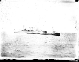 HMAS TORRENS I and heavy cruiser HMAS CANBERRA
