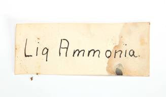 Bottle label reading 'liq ammonia'