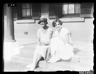 Two women at Victoria Barracks attending a tennis party