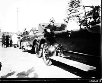 Admiral Robison and other US Navy officers seated in a procession of cars near Fort Macquarie