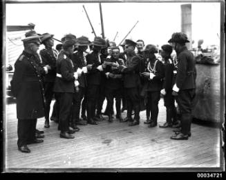 Uniformed men possibly from a military band on board the ship WELLINGTON