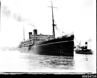 SS CATHAY II in Sydney Harbour with streamers flying from decks