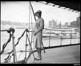 Mrs John Roxborough posing on the deck of HNLMS JAVA