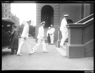 Royal Australian Navy officers ascending the steps at Parliament House in Sydney