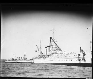 HMAS AUSTRALIA II or CANBERRA and other cruisers berthed near Garden Island