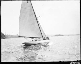 8-metre class yacht, possibly NORN, under sail possibly near Clark Island