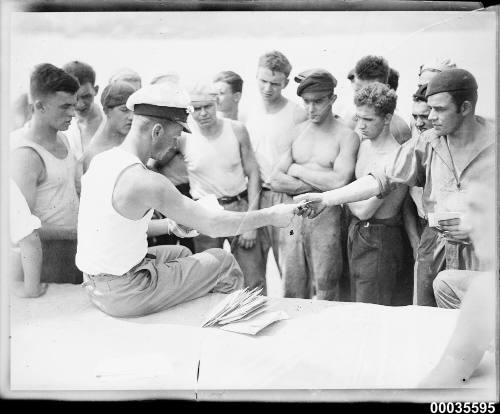 Officer distributing mail to the crew of MAGDALENE VINNEN