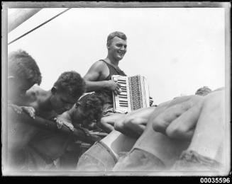 Crew men and an accordion player on board MAGDALENE VINNEN