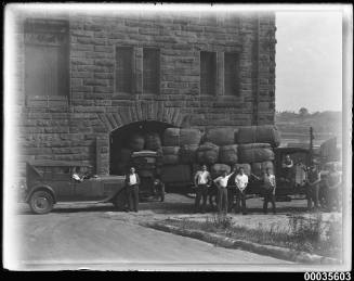 Men and wool bale trucks outside the Kellick woolstore in Lawson St, Pyrmont