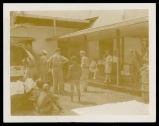 At Manado (Celebes), September 1945, hubby laying down the law to the Japs at their Headquarters