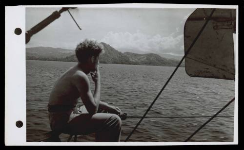 A16744 The green hills of Boeroe being appreciated by Stoker Theiler, RAN, from South Australia, on board HMAS GLENELG