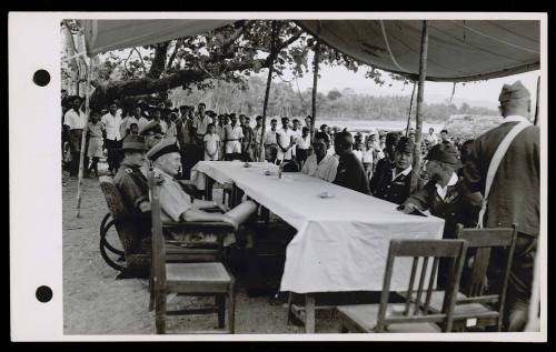 A16976 Lieut. Cmdr. Whitebrook of HMAS GLENELG, and Brigadier Steele at conference with Japanese officers at Piroe, Ceram, during Brigadier Steele's visit to the area