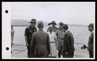 A16972  At Piroe, Ceram, Lieut. Cmdr. Whitebrook, of HMAS GLENELG and Brigadier Steele interrogate Japanese officers who were responsible for dumping of equipment. October 1945