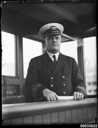 Captain posed on covered bridge