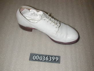 Left leather lace up shoe that forms part of WRANS summer uniform used by Margaret White