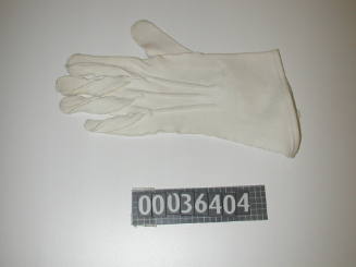 Left hand cotton glove that forms part of WRANS summer uniform used by Margaret White (matching glove 00036405)
