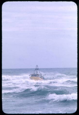 A prawn trawler seconds before being engulfed by a wave