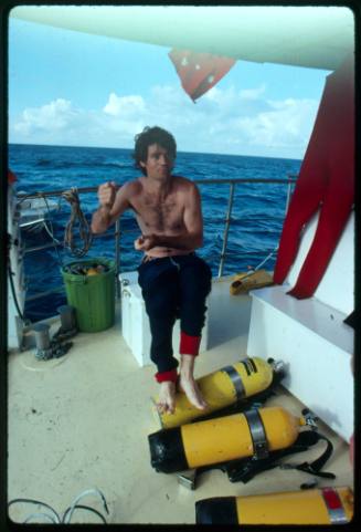 A diver on a vessel out at sea