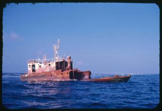 A shipwreck partially submerged in water