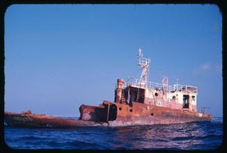 A shipwreck partially submerged in water