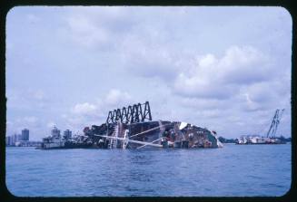 A capsized vessel close to the shore