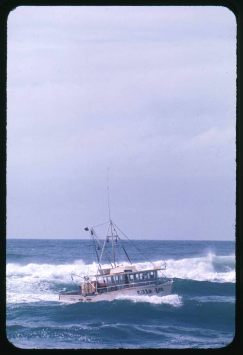 A small boat ‘Kirra- Lee in rough waters