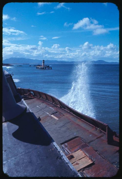 Photograph taken on a shipwreck looking at another shipwreck in the distance