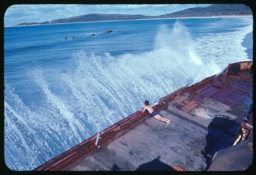 Man on the deck of a wrecked ferry