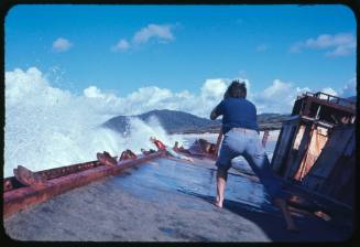 Photographer taking photo of Valerie Taylor on deck of shipwreck