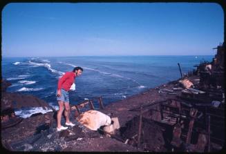 Ron Taylor standing on deck of a shipwreck