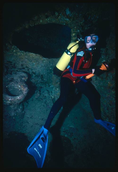 Diver at bathroom of wrecked vessel