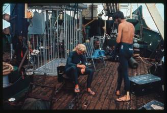 Valerie Taylor on the wooden deck of a vessel likely TERRIER VIII