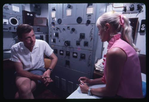 Valerie Taylor and a man talking inside a room of TERRIER VIII