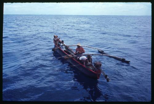 An outrigger canoe in the water