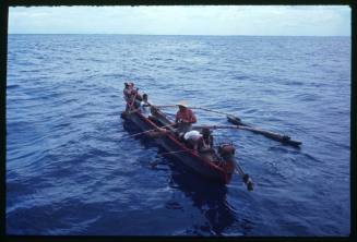 An outrigger canoe in the water