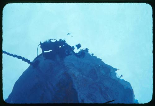 View of the hull of a vessel taken from underwater looking up to the surface