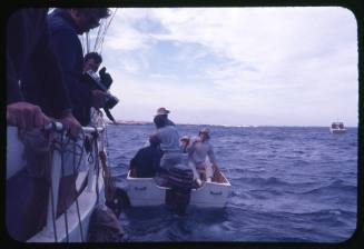 Five people on board a dinghy tied to the Terrier VIII during the period of filming of the documentary Blue Water, White Death