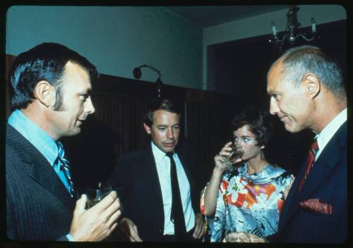 Ron Taylor and Stan Waterman having a drink with two other people