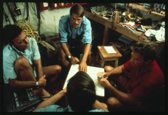 Ron Taylor and other members of the Blue Water, White Death documentary crew playing the card game hearts
