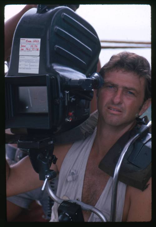 Portrait of one of the crew members from the documentary Blue Water, White Death holding a video camera on their shoulder