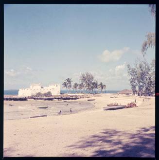 A beach at low tide and village near the shoreline